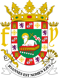 Escudo actual de Puerto Rico, donde además de las banderas de Castilla y León, aparecen el yugo, las flechas y las iniciales de Fernando e Ysabel.